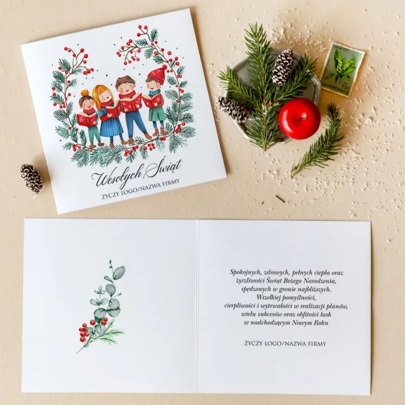 Kartka świąteczna z ilustracją dzieci w kolorowych zimowych strojach śpiewających kolędy, otoczonych wieńcem z gałązek Kartka świąteczna z ilustracją dzieci w kolorowych zimowych strojach śpiewających kolędy, otoczonych wieńcem z gałązek