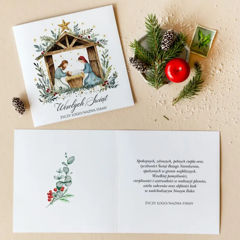 Kartka świąteczna z narodzeniem Jezusa w stajence, otoczona zielonymi gałązkami i czerwonymi jagodami Kartka świąteczna z narodzeniem Jezusa w stajence, otoczona zielonymi gałązkami i czerwonymi jagodami